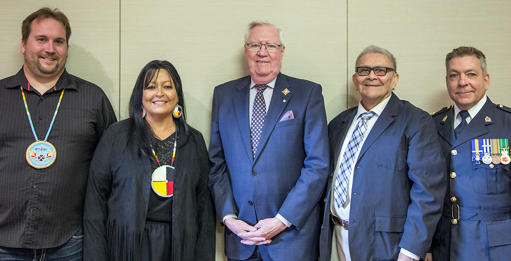 Photo from left to right-
Chris McKee; Converging Pathways – Kallie Wood; Converging Pathways; His Honour the Honourable W. Thomas Molloy; Lieutenant Governor of Saskatchewan -  Chief Dr. Robert Joseph; Reconciliation Canada – Chief Rick Bourassa; Moose Jaw City Police.